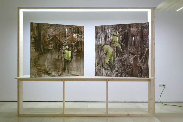 Two faceted photographic sculptures of construction sites